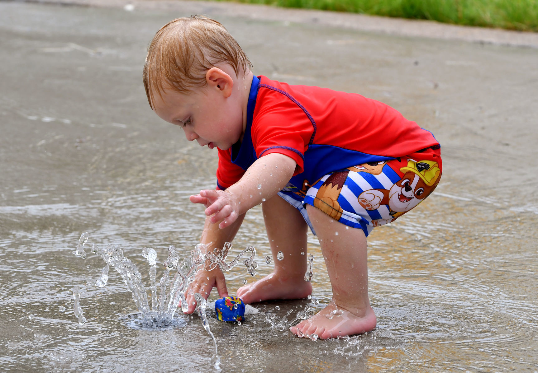 People cooling off on a hot day at Splash Landing in Bettendorf.